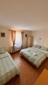 Giường trong phòng chung tại Casa Anna