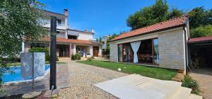 a house with a swimming pool in a yard at AURA Residence in Rovinj