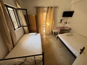 Ένα ή περισσότερα κρεβάτια σε δωμάτιο στο Seaside Apartments & Rooms Kampouri
