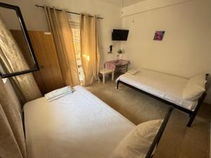 Ένα ή περισσότερα κρεβάτια σε δωμάτιο στο Seaside Apartments & Rooms Kampouri