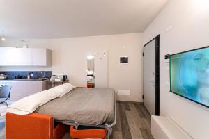 Ένα ή περισσότερα κρεβάτια σε δωμάτιο στο Residenza Cavour - Appartamento B