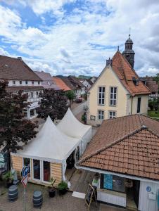 an overhead view of a market in a town at Harzflair am Hausberg - Große moderne 135qm Ferienwohnung mit Balkon für bis zu 6 Gäste im Zentrum in Bad Lauterberg +14 photos