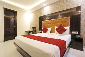 Voodi või voodid majutusasutuse P S Grand By Iconic Near Delhi International Airport toas