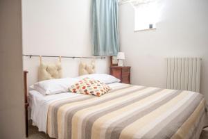 A bed or beds in a room at Charming Trulli