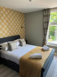 Posteľ alebo postele v izbe v ubytovaní The Ardingly Inn