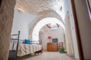 A bed or beds in a room at Charming Trulli