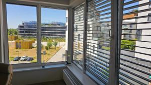 a room with two windows with blinds at Byt v centru Ostravy in Slezská Ostrava +4 photos