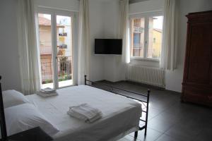 a bedroom with a bed with two towels on it at Residence Carmen in Falconara Marittima