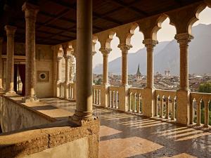 a building with columns and a view of a city at FREE PARKING-HISTORICAL LUXURY PALACE- CITY VIEW-Free Wifi&Pet Friendly in Trento