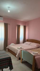 Ένα ή περισσότερα κρεβάτια σε δωμάτιο στο Armela Guest House
