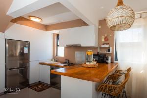 Η κουζίνα ή μικρή κουζίνα στο Villa Bel Lavi - Plage à 5 min & Services sur-mesure