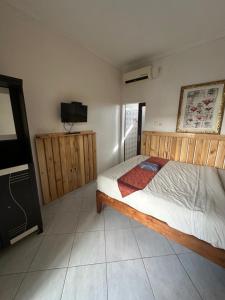 Postel nebo postele na pokoji v ubytování Sari Buana Bed & Breakfast