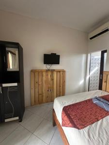 TV a/nebo společenská místnost v ubytování Sari Buana Bed & Breakfast