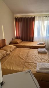 Ένα ή περισσότερα κρεβάτια σε δωμάτιο στο Armela Guest House