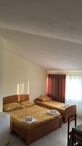 Ένα ή περισσότερα κρεβάτια σε δωμάτιο στο Armela Guest House