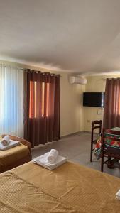 Μια τηλεόραση ή/και κέντρο ψυχαγωγίας στο Armela Guest House +17 φωτογραφίες