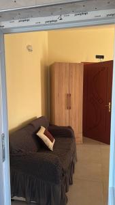 Ένα ή περισσότερα κρεβάτια σε δωμάτιο στο Armela Guest House