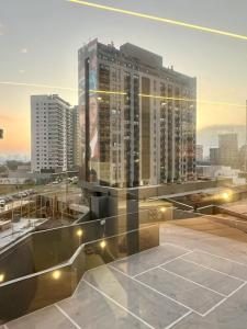 a view of a city skyline with a large building at Studio Cute, Parque Una in Pelotas