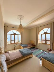Postel nebo postele na pokoji v ubytování Taghazout Surf Villa - All-Inclusive