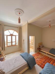 Postel nebo postele na pokoji v ubytování Taghazout Surf Villa - All-Inclusive