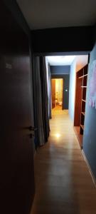a hallway leading to a room with a door and a hallwayngth at GRAND - Beachfront Rooms & Apartments in Selce