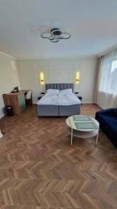 a bedroom with a bed and a coffee table at Fuego in Rowy