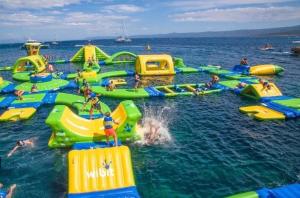 a large group of inflatable slides in the water at Beachside Luxury Apartment in Puerto Banus - Club Playas del Duque in Marbella