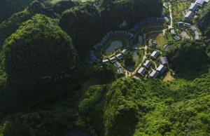 an aerial view of a park in the middle of a forest at Jiva Hoa Lu Retreat in Ninh Binh