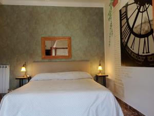 Postel nebo postele na pokoji v ubytování FalcoBianco GuestHouse