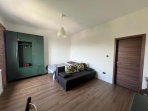 a living room with a couch and a bed at Balcony 4 bedroom apartment by Book-Rijeka in Rijeka