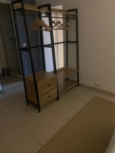 a room with a wooden shelf and a dresser at en baie du mont saint Miche Proche bord de mer in Saint-Benoît-des-Ondes