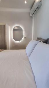 a large white bed in a room with a window at Marina's House in Kinídharos +11 photos