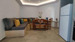 a living room with a couch and a table at Marina's House in Kinídharos