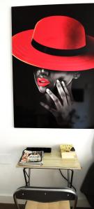 a picture of a woman wearing a red hat at Seaview Playa del Cura 50m Torrevieja CityCentre Apartment in Torrevieja