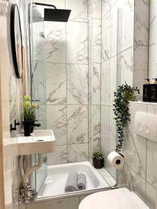a bathroom with a white tub and a sink at Magarethe in Essen