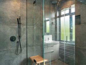a bathroom with a glass shower and a sink at Country Home in Idyllic South Downs - Views, Free Parking for 7 cars, Play room, Steam room, Fire Pit and more in Kingston near Lewes