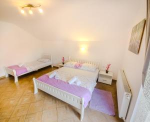 Postel nebo postele na pokoji v ubytování Guest House Mačić