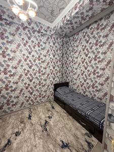 Postel nebo postele na pokoji v ubytování Oʻzbegim