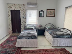 Ένα ή περισσότερα κρεβάτια σε δωμάτιο στο EasyOne Cottage Homestay +2 φωτογραφίες