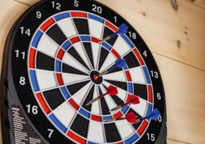 a dartboard with darts in the center of a wall at Homestead Bluff in Sevierville