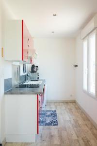 a kitchen with a sink and a counter top at La Casinière Coëtquidan in Guer