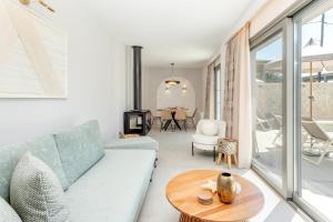 a living room with a couch and a table at Villa Stella in Gouvia