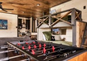 a living room with a stove with red toy figures on it at Homestead Bluff in Sevierville