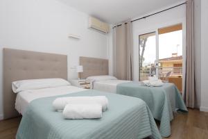 En eller flere senge i et værelse på Albers Apartment