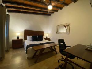 Postel nebo postele na pokoji v ubytování Hotel Suites Mar Elena