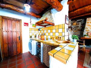A kitchen or kitchenette at Petit Nazari