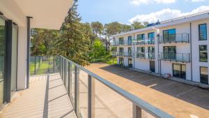 an empty balcony of a building at Rezydencja Niechorze D209 Classik z Basenem i Spa oraz z 2 sypialniami - 5D Apartments in Niechorze