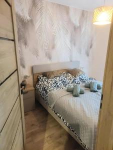 Кровать или кровати в номере Słoneczna Dolina ze strefą SPA
