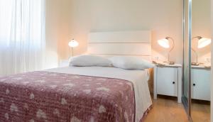 Ein Bett oder Betten in einem Zimmer der Unterkunft Villa Diana