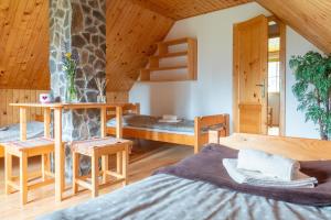 a bedroom with a giraffe stone wall at Chata DIANA - Kraviarky in Liptovský Ján